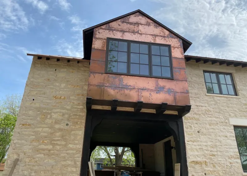 Copper metal panel facade on a stone building for Skylight Installation in Palm Bay